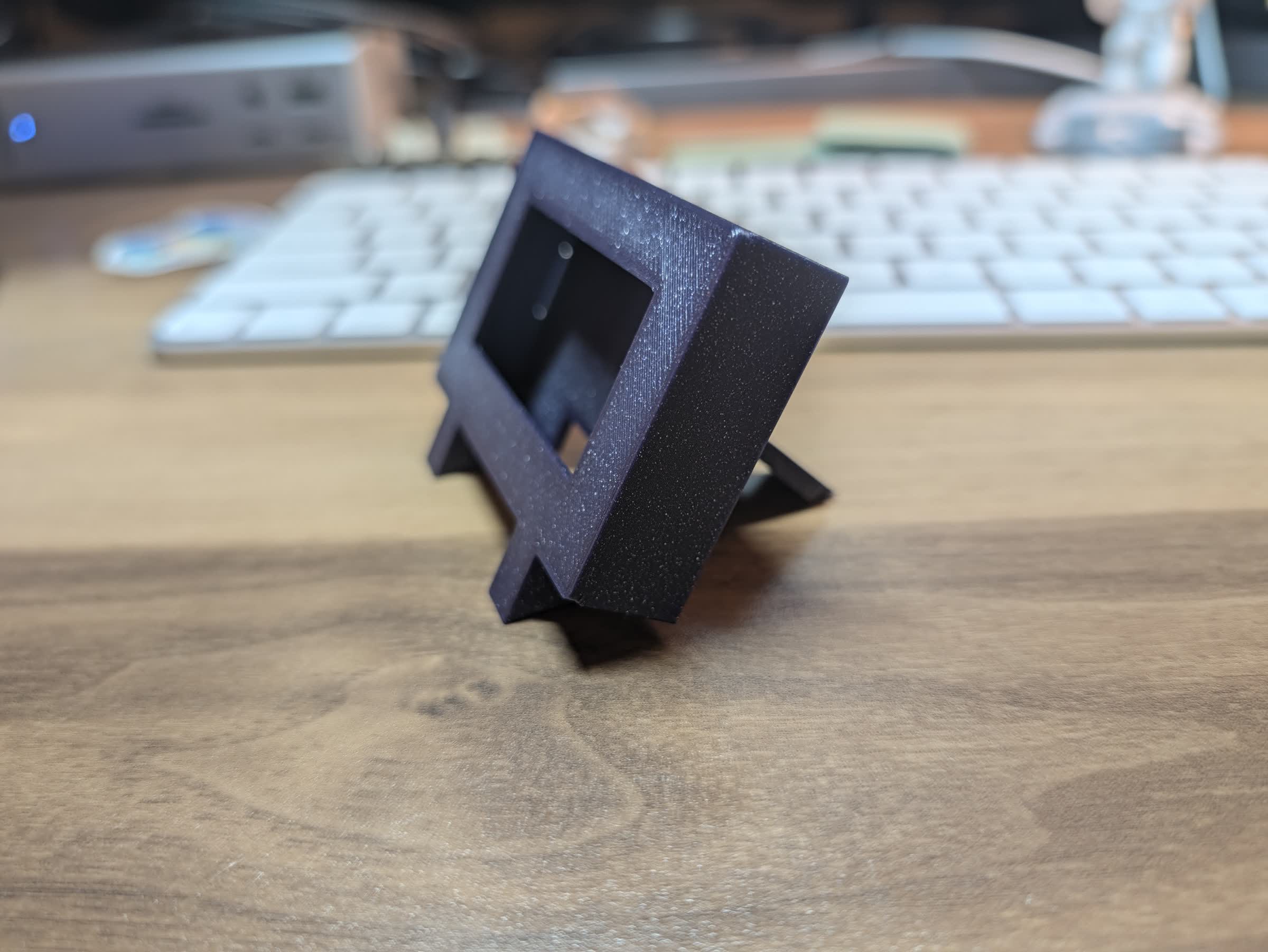 The finished enclosure from the side, showing the backward lean
