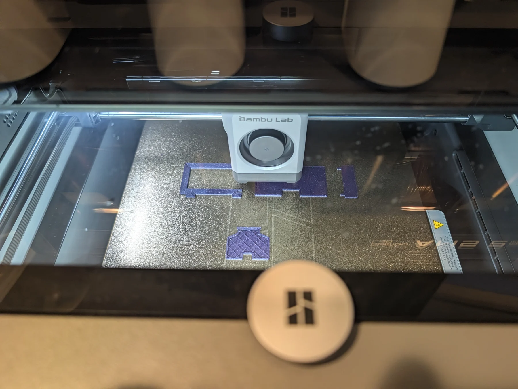 First enclosure print beginning on the textured Bambu build plate