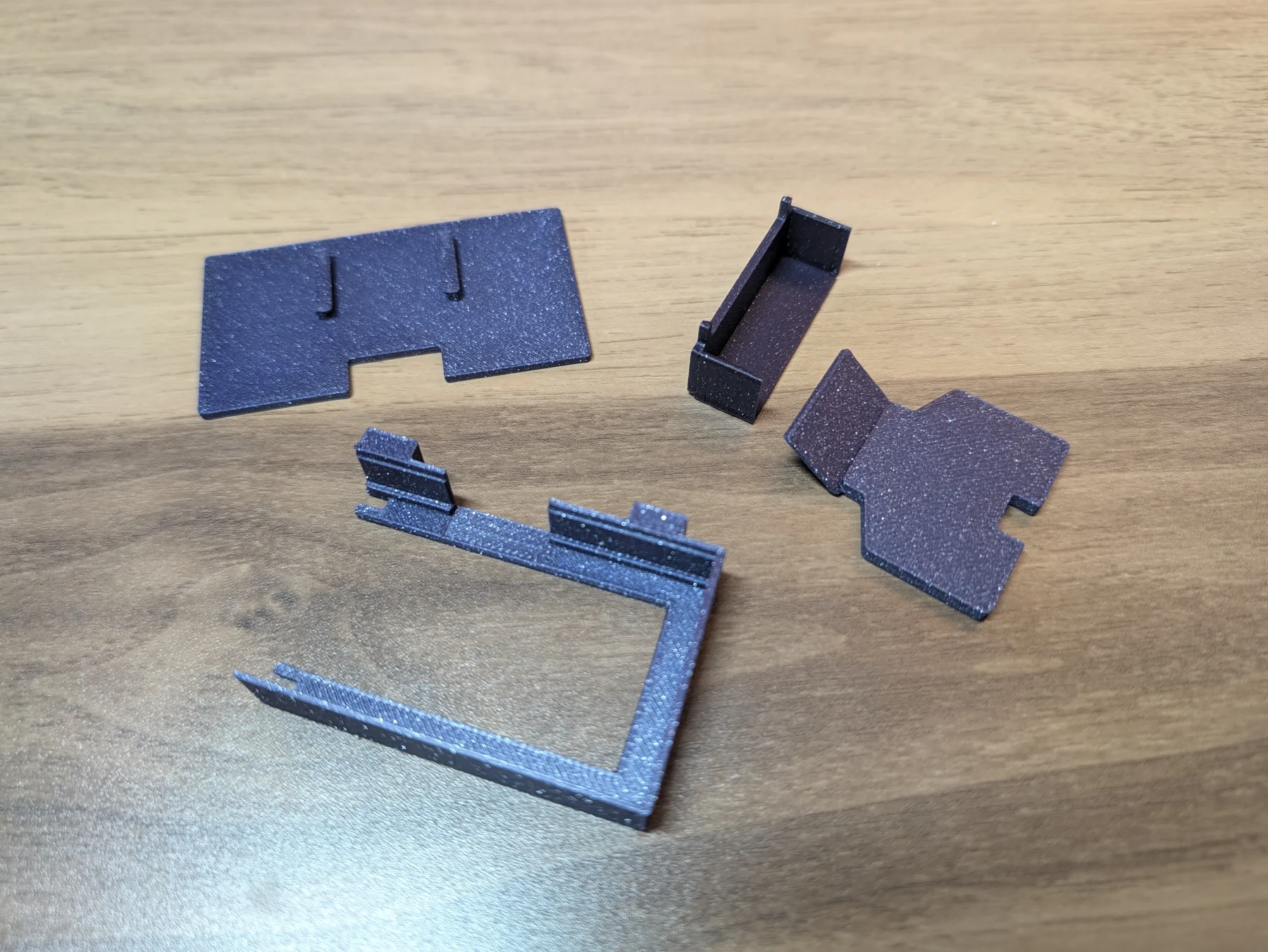 The four pieces from the first print laid out on a desk