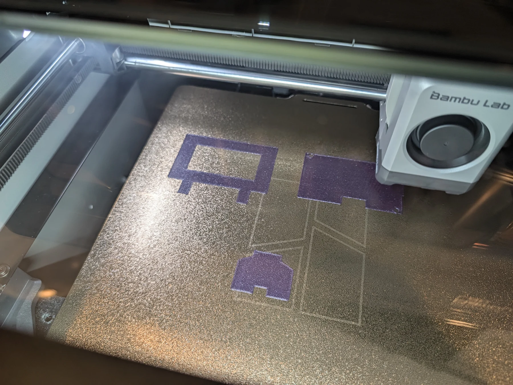 V3 frame, backplate, and leg beginning on the textured build plate