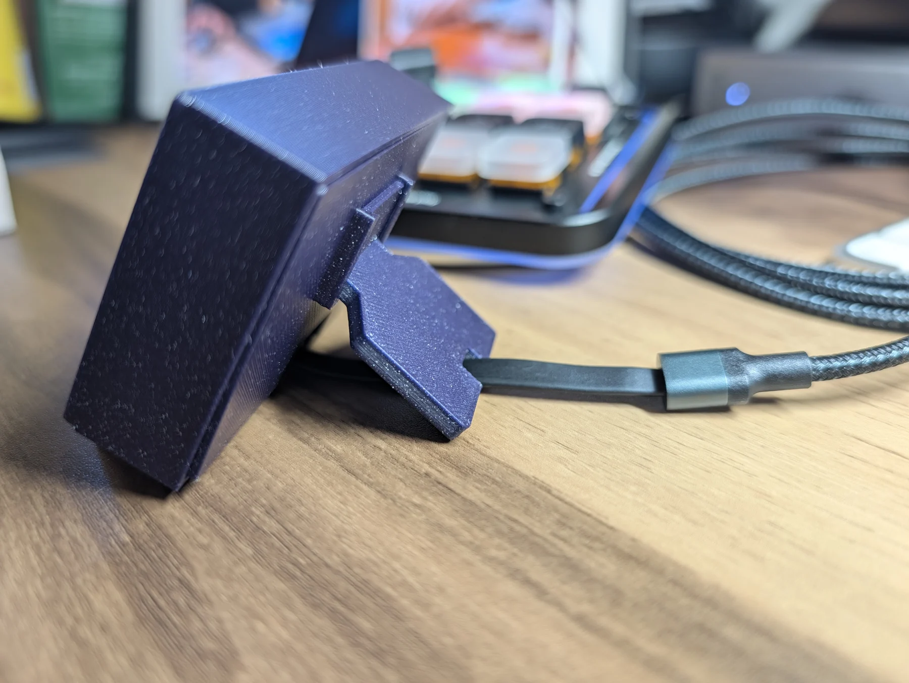 V3 rear leg and USB-C cable shown where they meet the desk