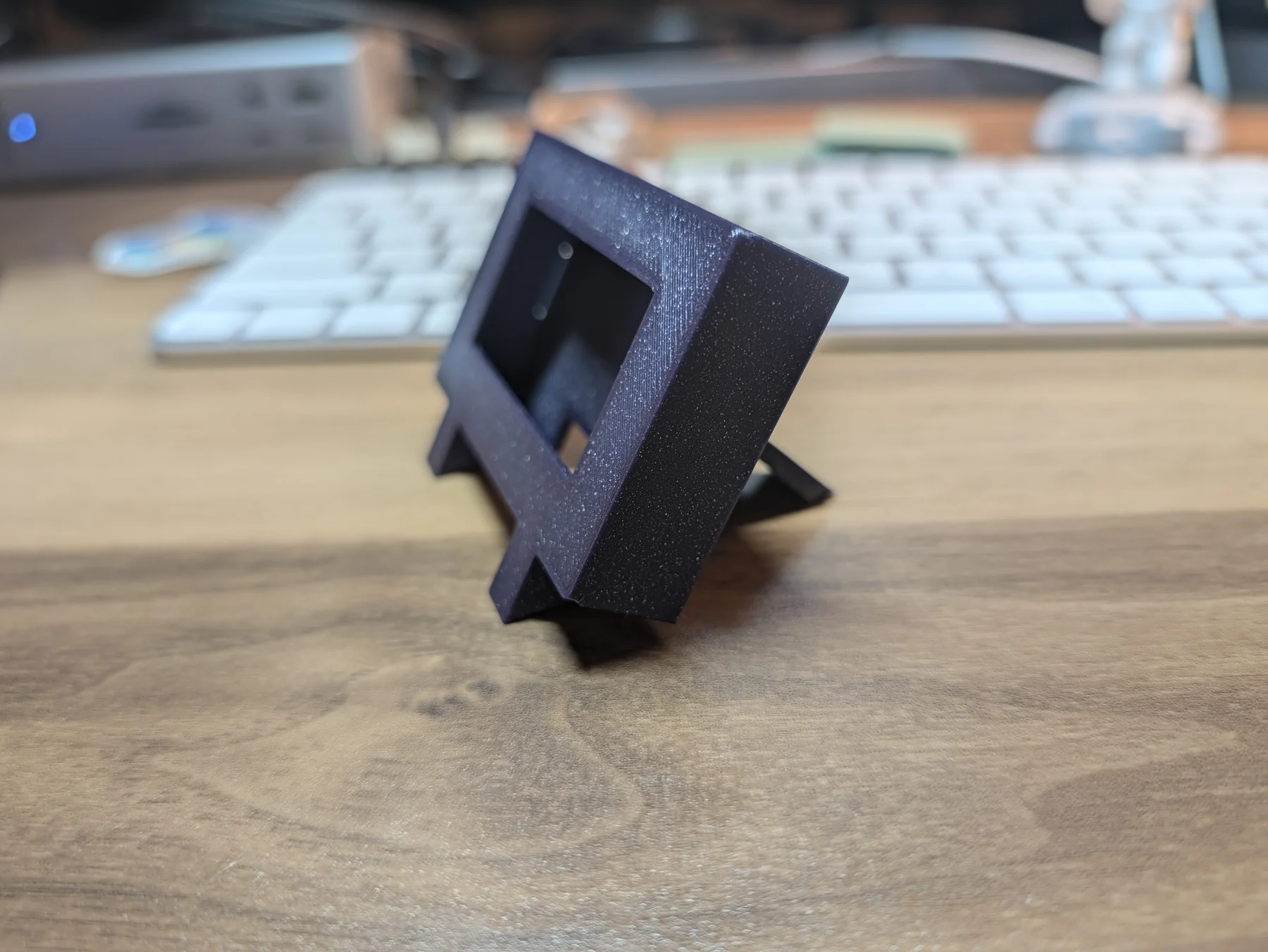 Side profile of the assembled V4 enclosure showing its backward lean